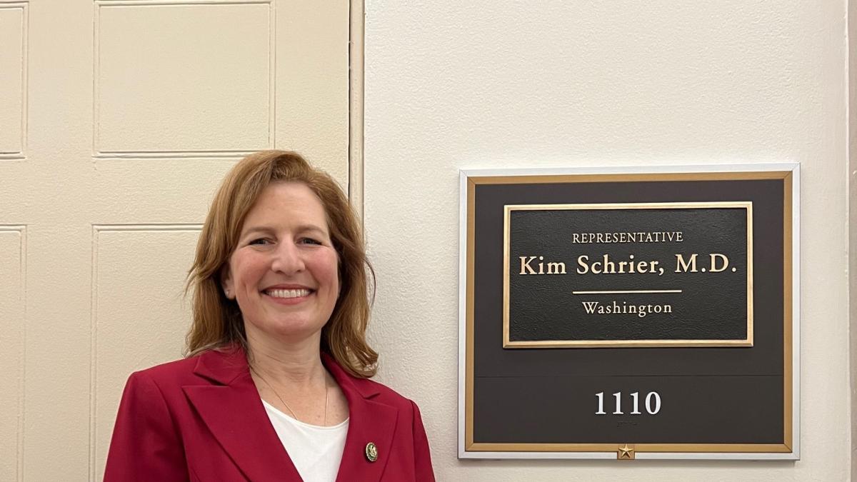 Rep. Schrier in front of her new office
