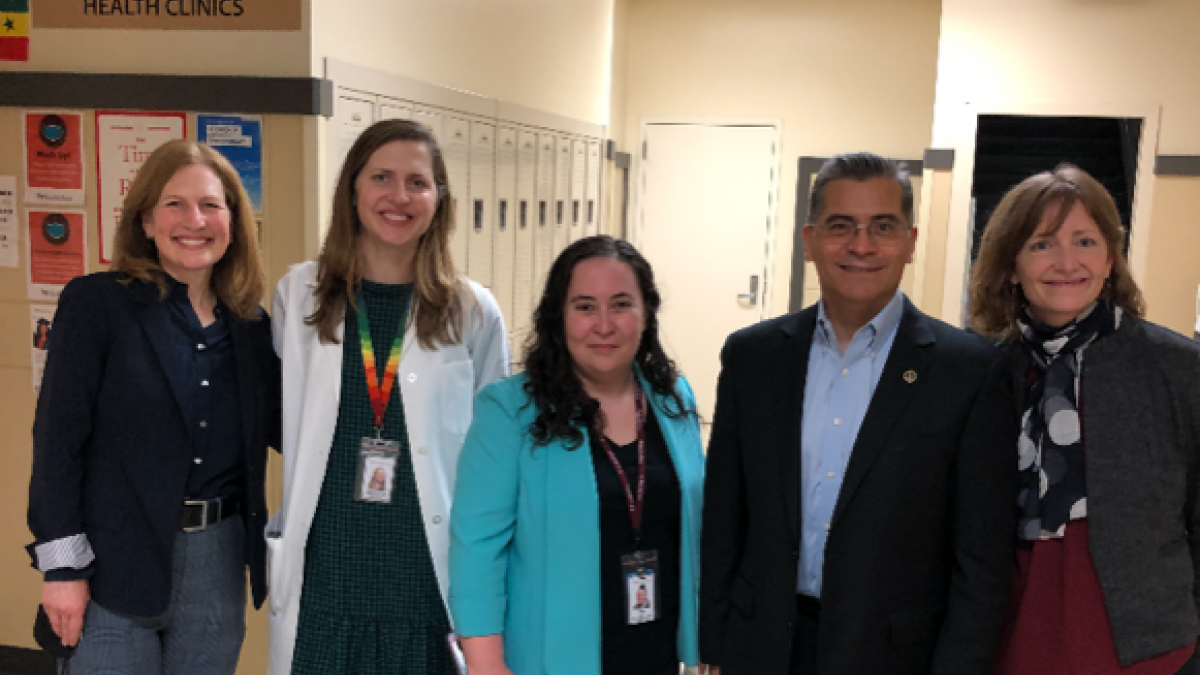Rep. Schrier and Secretary Becerra with the HealthPoint team at Renton High School.