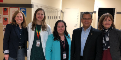Rep. Schrier and Secretary Becerra with the HealthPoint team at Renton High School.