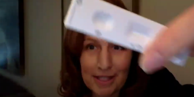 Schrier holding rapid test