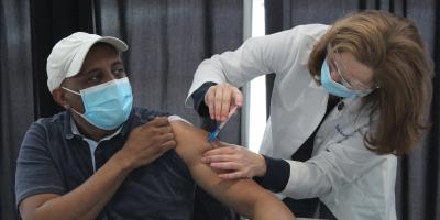 Rep. Schrier administering COVID-19 vaccine