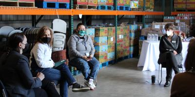 U.S. Rep. Schrier speaking with reps from local food banks