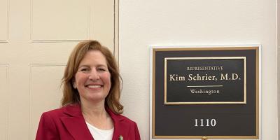 Rep. Schrier in front of her new office